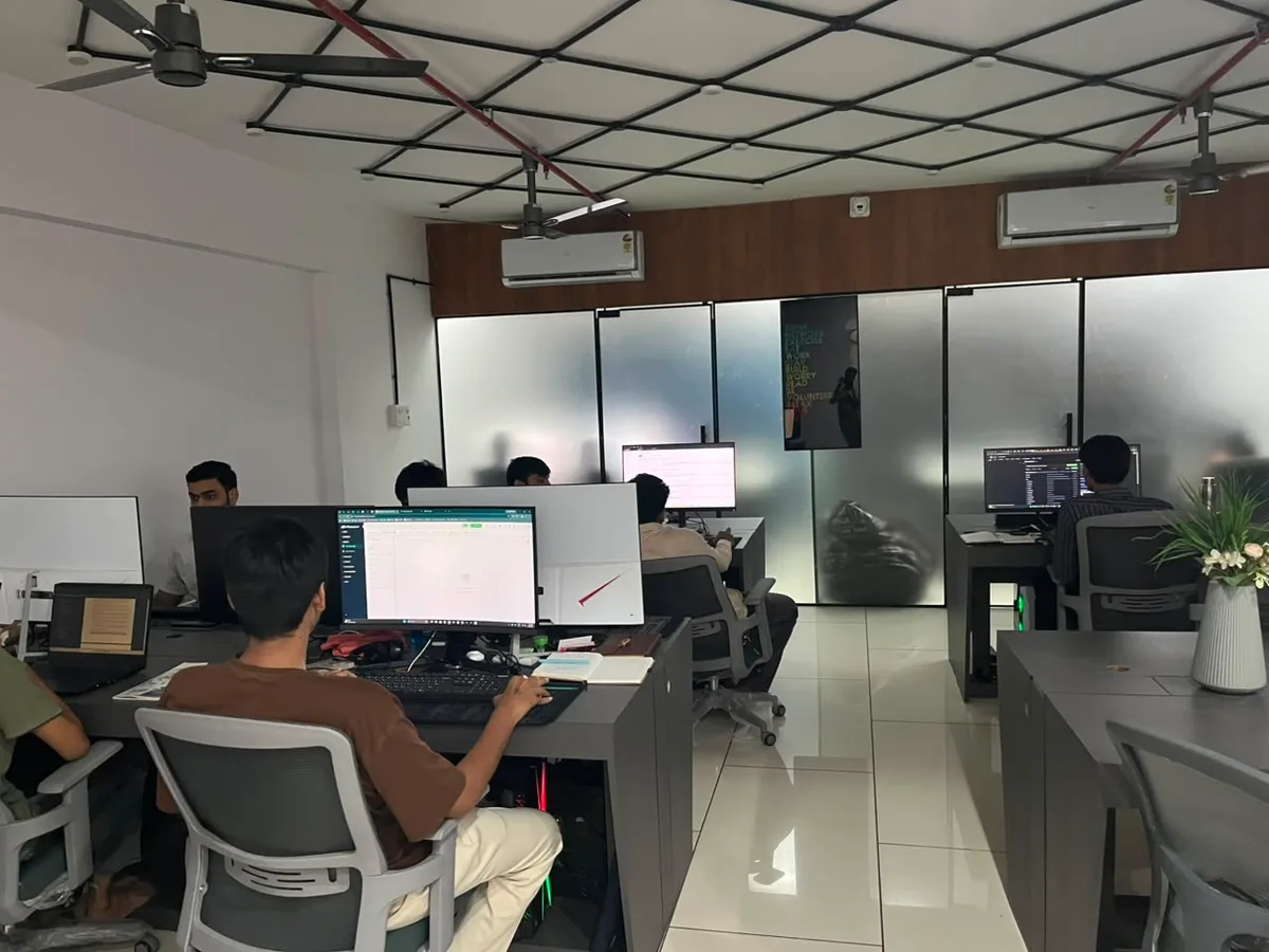 Engineers at their workstations in the Surat office